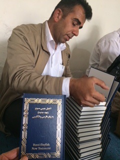 Writing in bibles destined for Iran. 