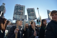 Pupil placards read: 'System change not climate change. One solution: revolution'