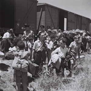 Holocaust survivors alight at Atlit refugee camp, 1945.