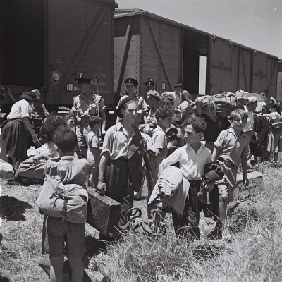 Holocaust survivors alight at Atlit refugee camp, 1945.