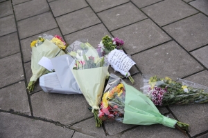 Tributes in West Kensington, where a teenager was fatally stabbed on Thursday.